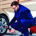 Mechanic putting air in tires
