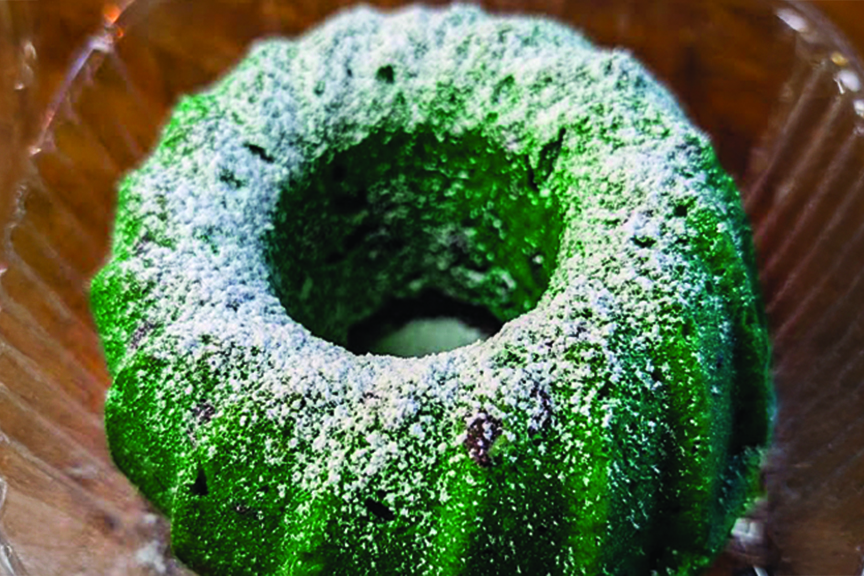 Green mint chocolate chip poundcake, dusted with confectioners sugar