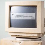 Dusty old Apple computer showing system error screen