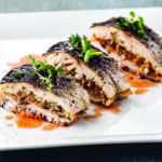elegantly plated almond -stuffed rainbow trout