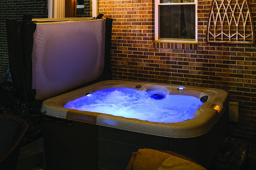 Water bubbles in a hot tub outside a home
