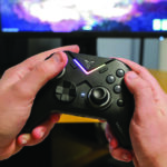 Close-up of hands holding a video game controller