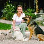 Actress Kaley Cuoco and three dogs