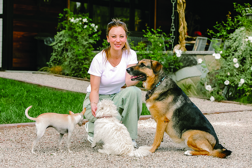 Actress Kaley Cuoco and three dogs