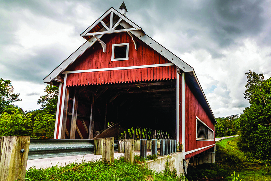 red covered bridge in a scenic setting
