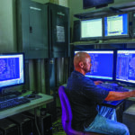 A man works inside a data center