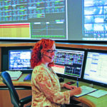 A woman works in a control room