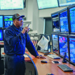 A man works inside the central command center at the Wildcat Point Generation Facility