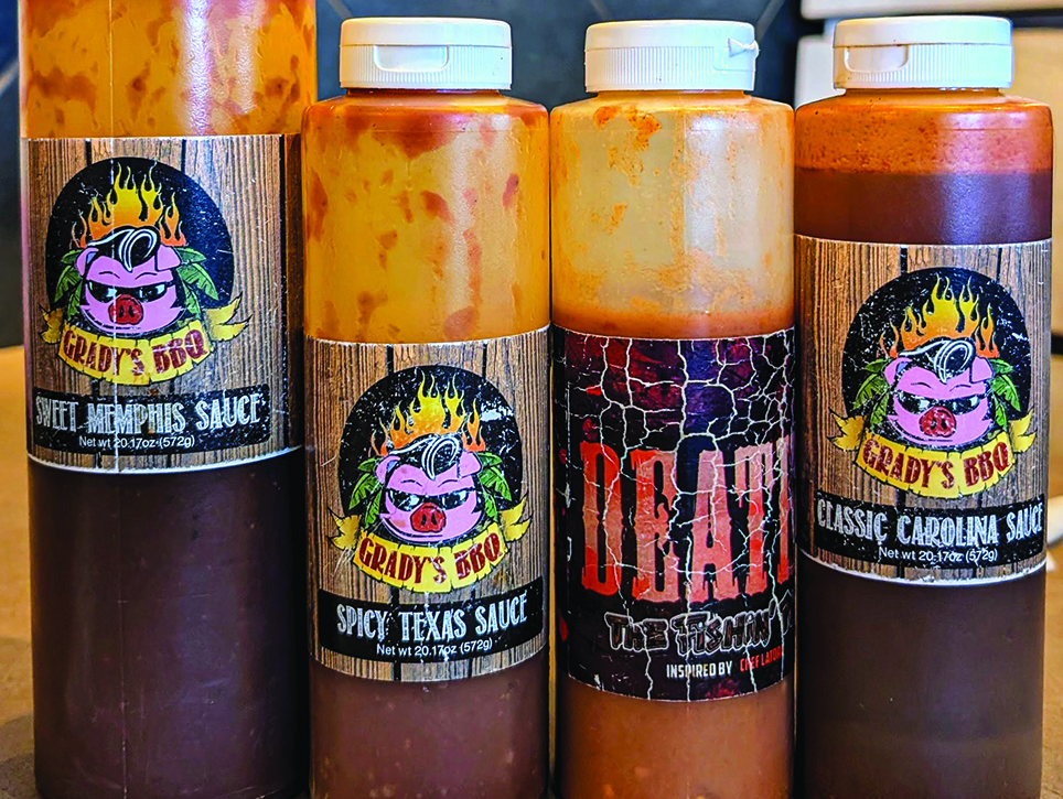 Four bottles of various barbecue sauces