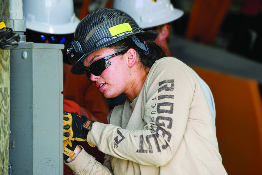 DehlilaRay Roop installs an electric meter base in class at SVCC's Power Line Worker Training School.