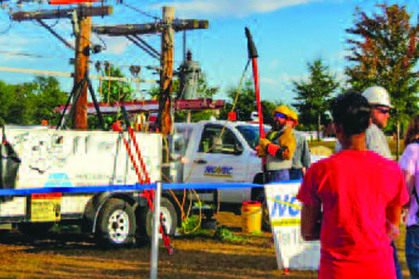 Lineworkers show their equipment