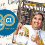 Illustration shows Cooperative Living's logo behind an 80th anniversary illustration and the October 2006 issue of the magazine, featuring a man holding up a copy of a July 1948 issue of Rural Virginia
