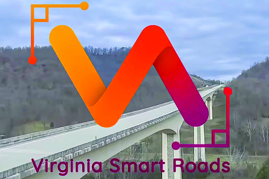Logo for Virginia Smart Roads featuring a stylized, gradient orange and red "V" icon over a photograph of a long highway bridge spanning a mountain valley.