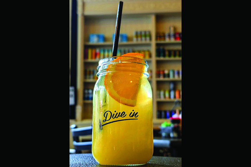 Small Jar contains orange drink with orange slice and black straw. The words "Dive In" are on the glass