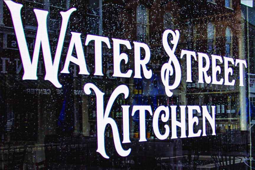 The words "Water Street Kitchen" appear on one of the restaurant's front windows