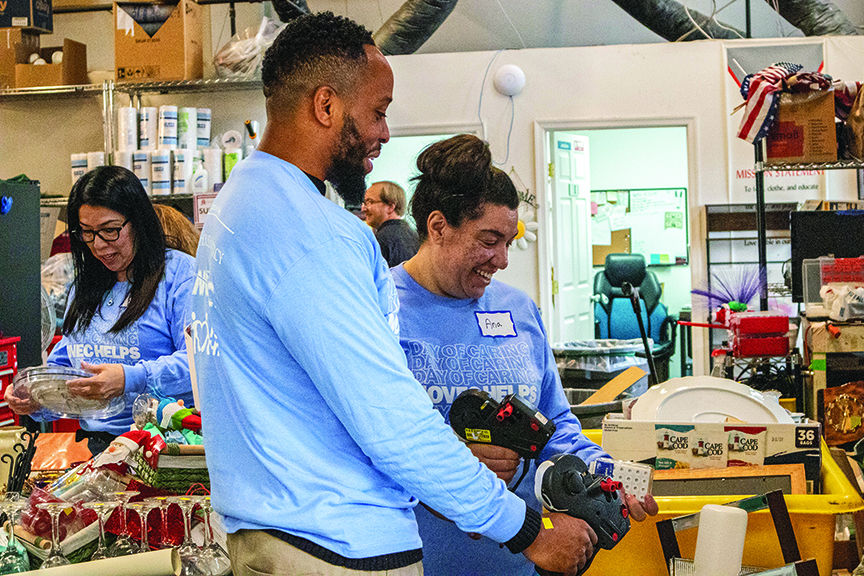 NOVEC employees sort donations at House of Mercy in Manassas during the co-op’s annual Day of Caring.